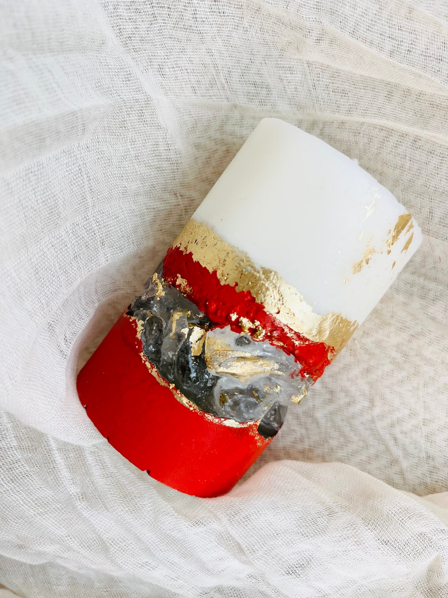 Close-up of luxury soy wax candle with gold geode accents